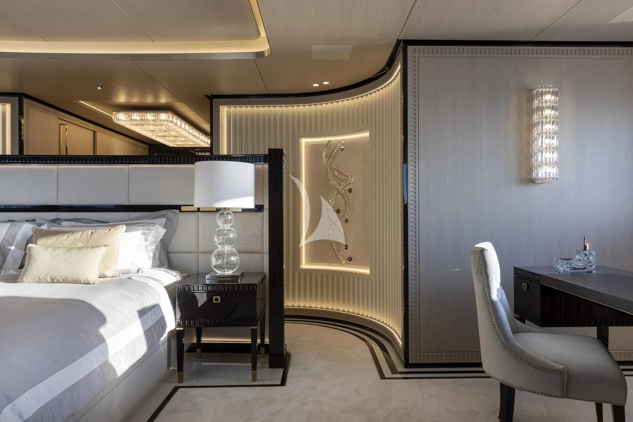 a bedroom with a bed and a desk aboard POLESTAR Yacht for Sale