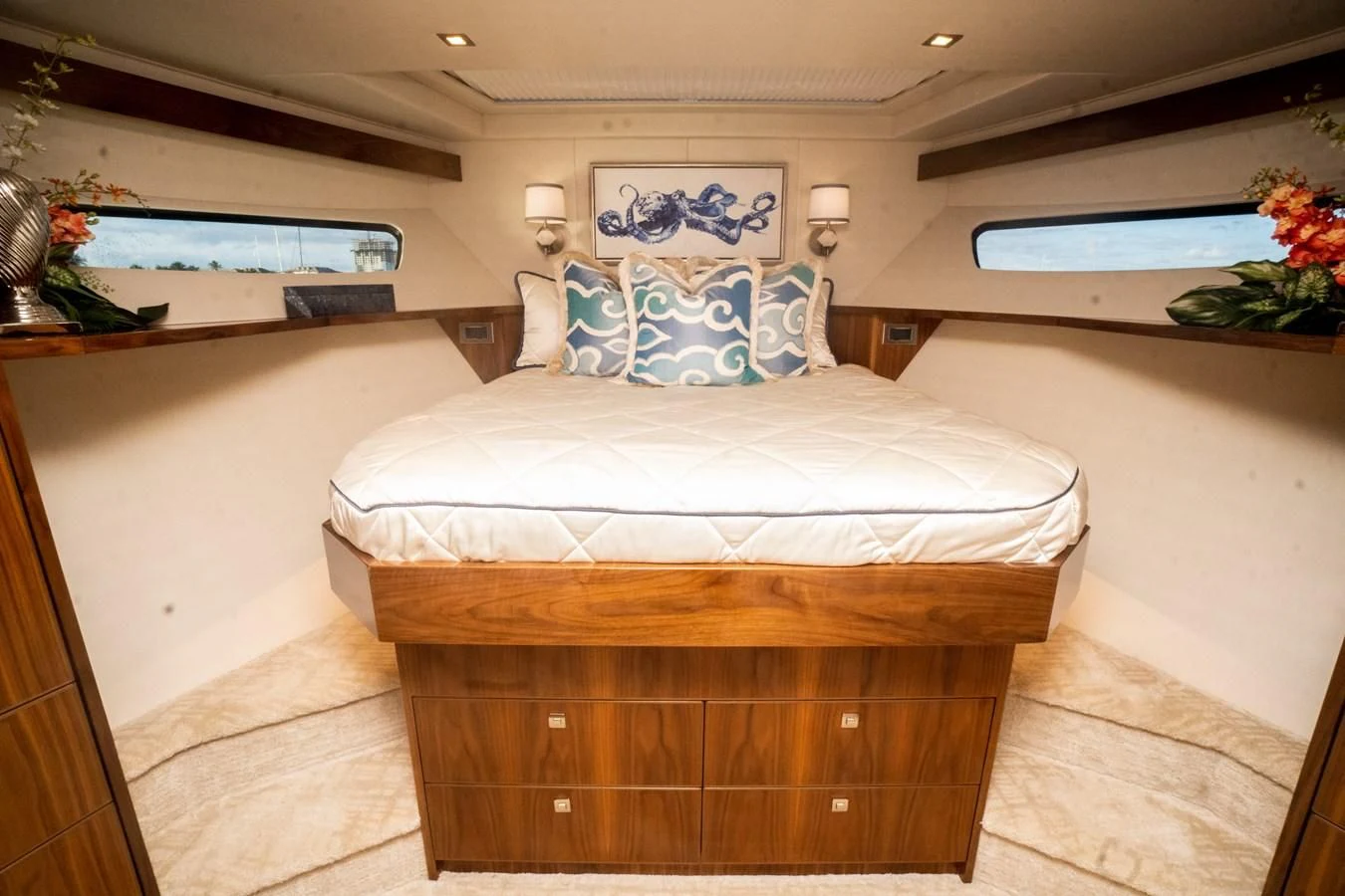 a room with a bed and a dresser aboard KALEEN Yacht for Sale