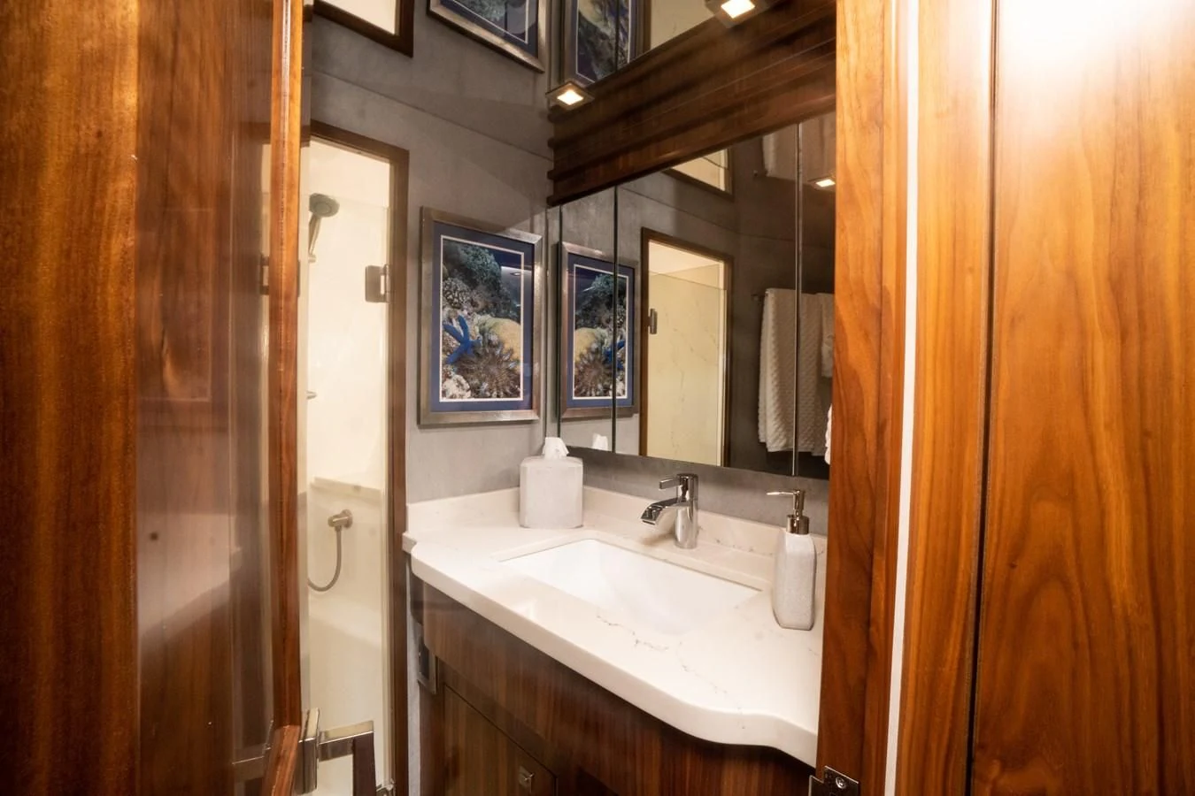 a bathroom with a sink and mirror aboard KALEEN Yacht for Sale