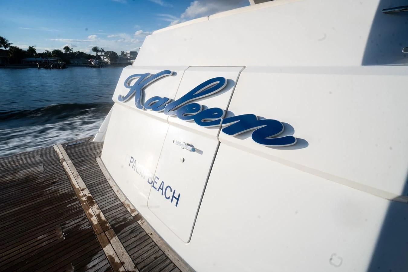 a white boat with blue lettering aboard KALEEN Yacht for Sale