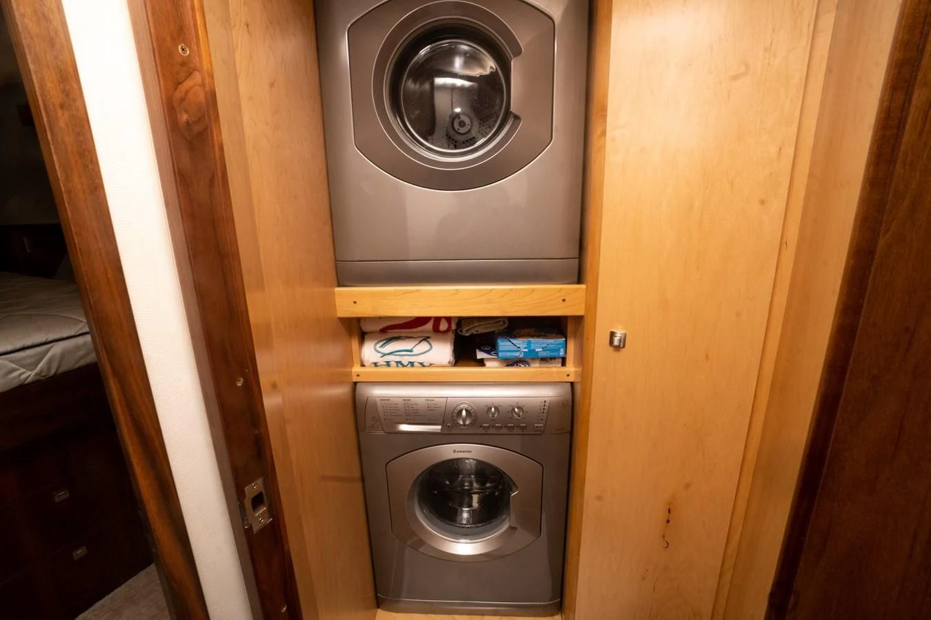 a wooden cabinet with a fan aboard KALEEN Yacht for Sale