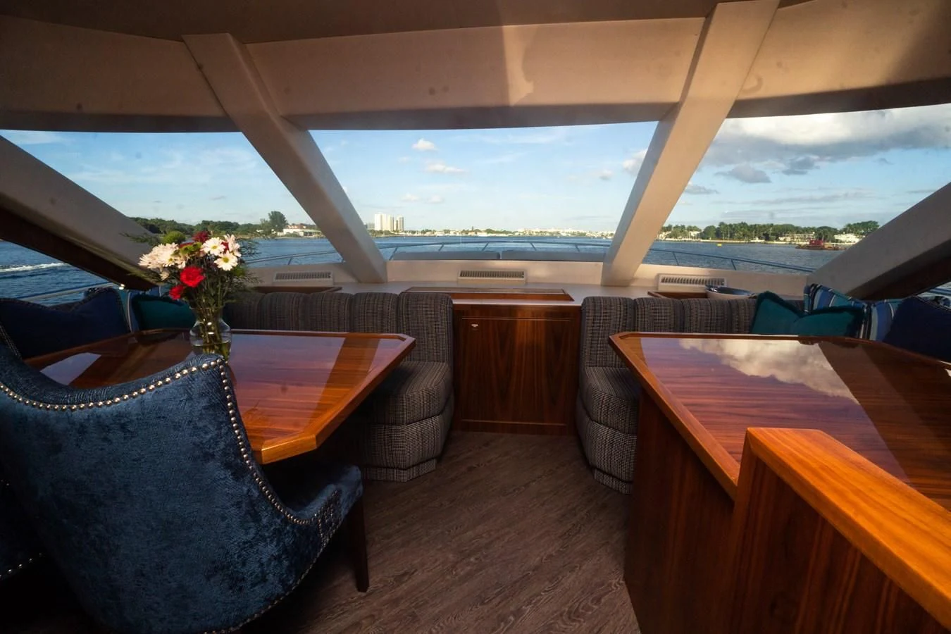 a room with a table and chairs aboard KALEEN Yacht for Sale