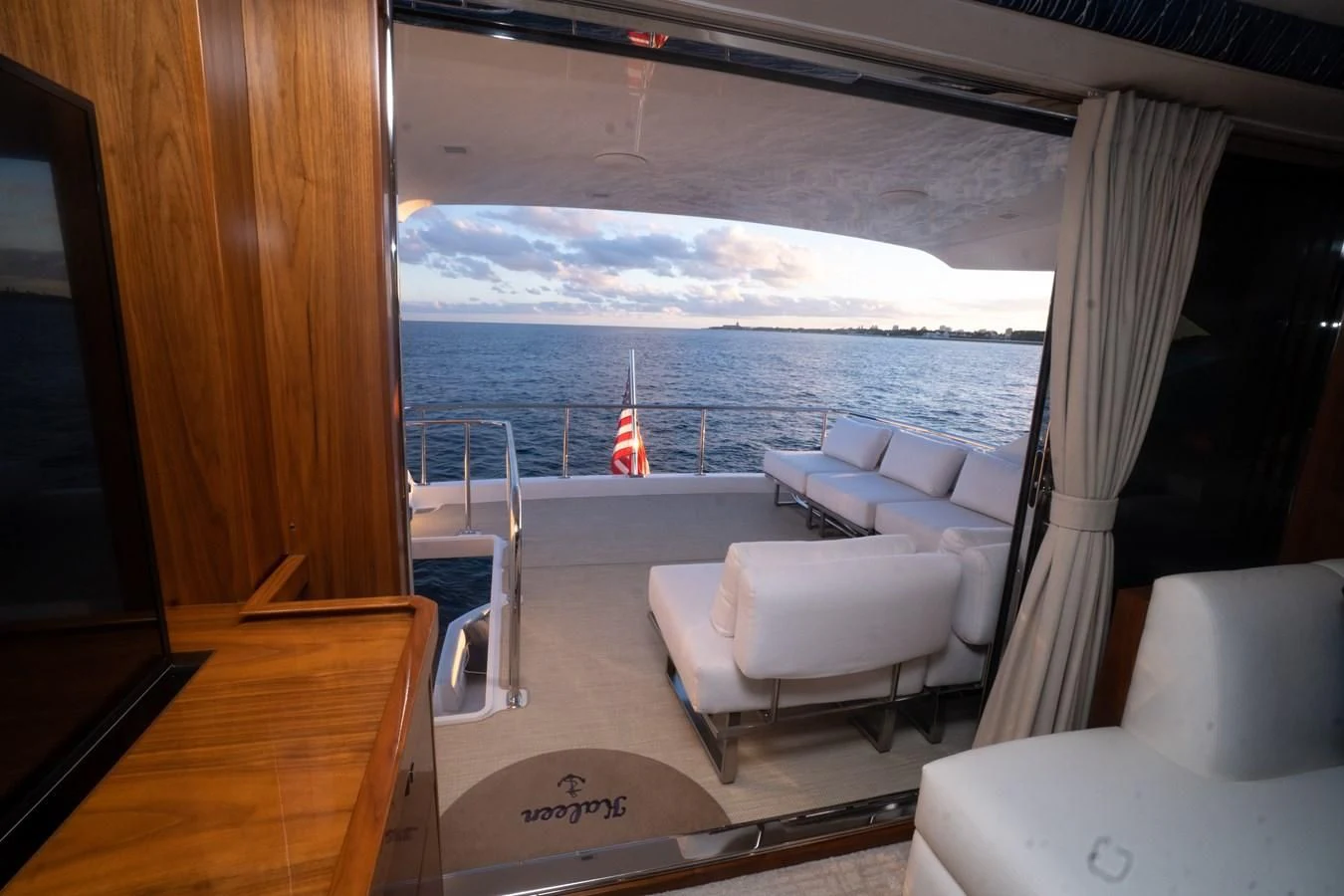 a room with a view of the ocean and a beach aboard KALEEN Yacht for Sale