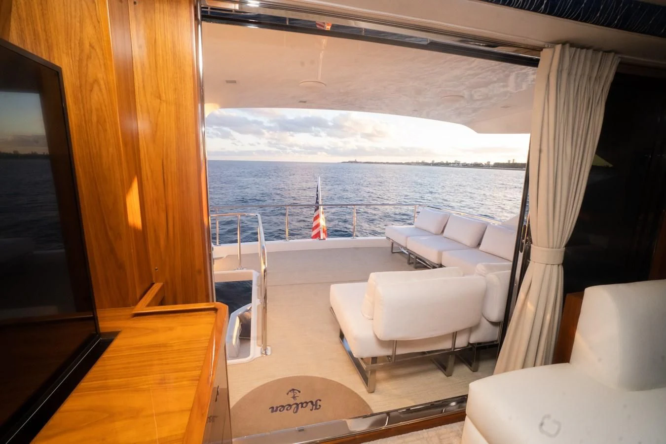 a room with a view of the ocean and mountains aboard KALEEN Yacht for Sale