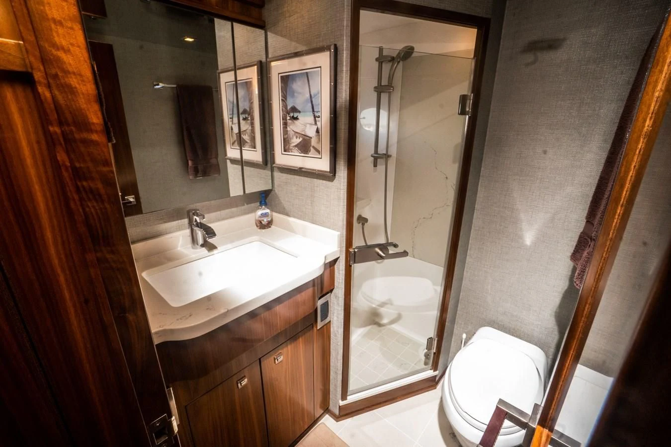 a bathroom with a large mirror aboard KALEEN Yacht for Sale