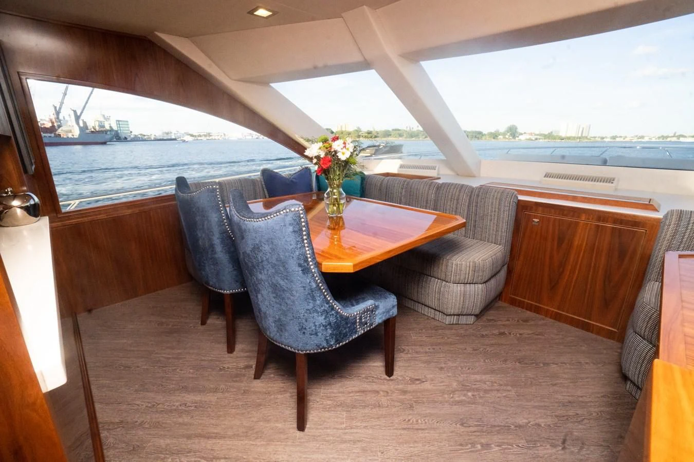 a room with a table and chairs aboard KALEEN Yacht for Sale