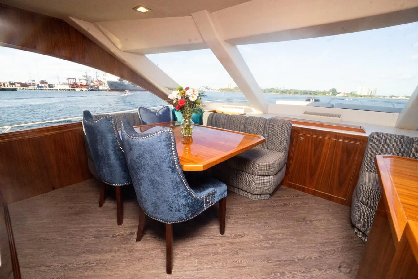 a room with a table and chairs aboard KALEEN Yacht for Sale