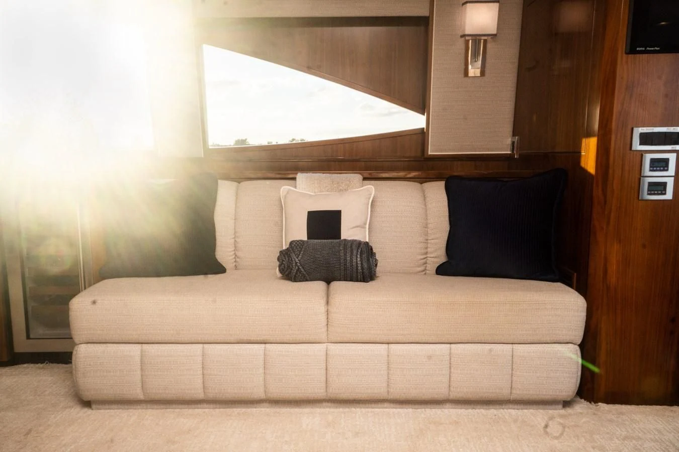 a couch with pillows on it aboard KALEEN Yacht for Sale