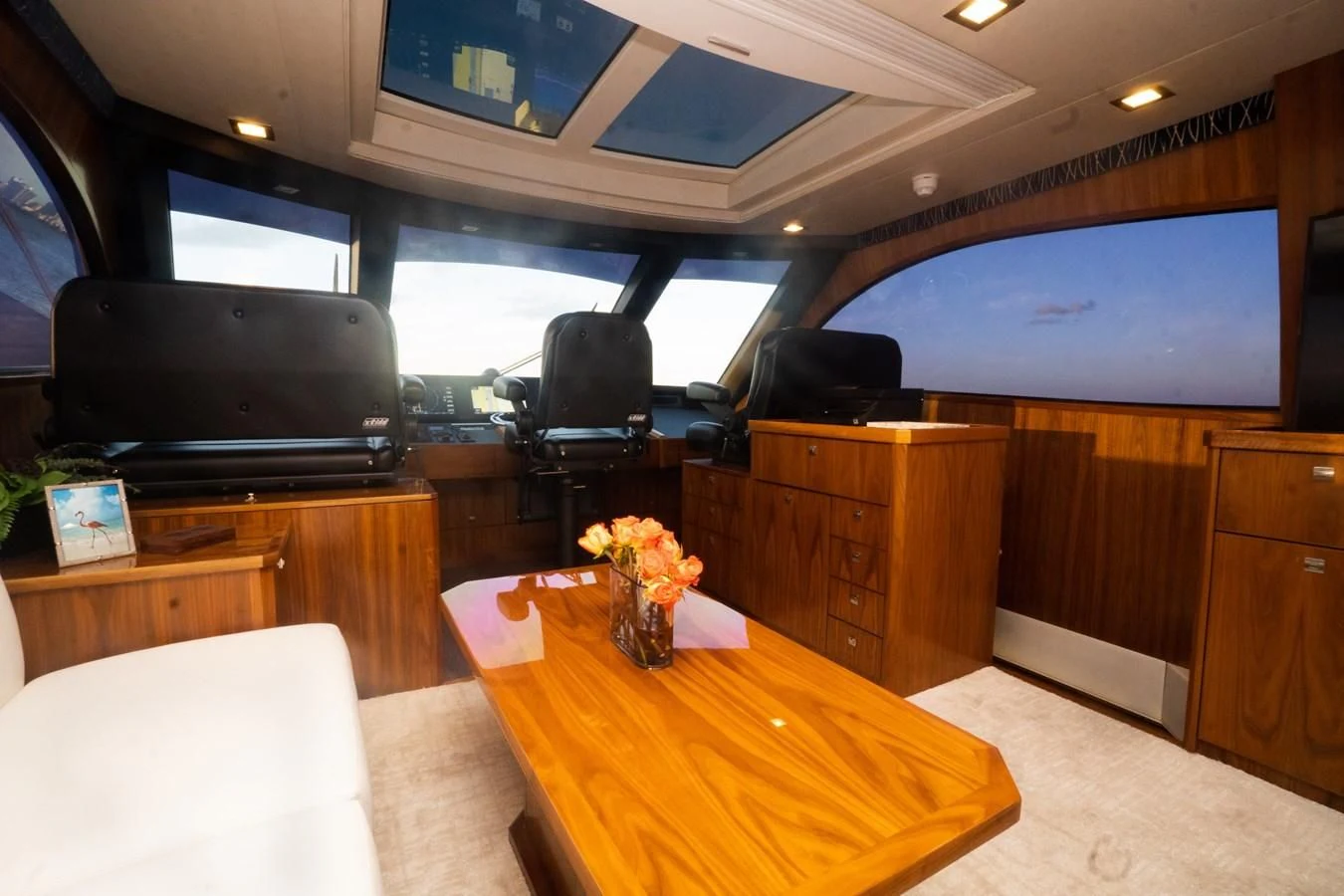 a room with a tv and a table aboard KALEEN Yacht for Sale