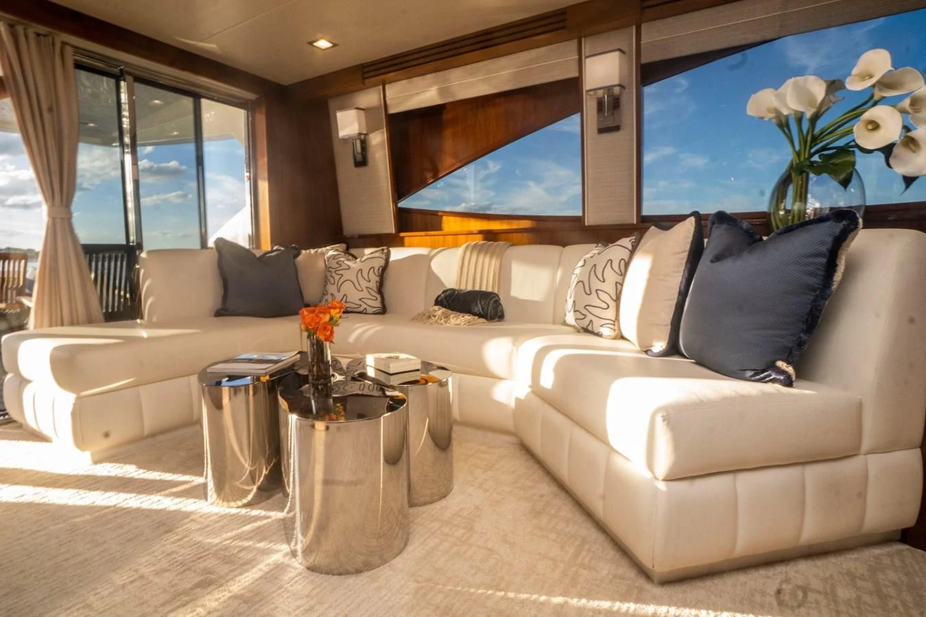 a living room with a couch and a coffee table aboard KALEEN Yacht for Sale