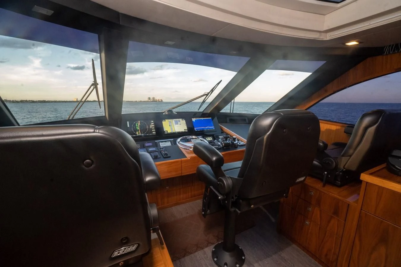 a room with a chair and a desk with a computer on it aboard KALEEN Yacht for Sale