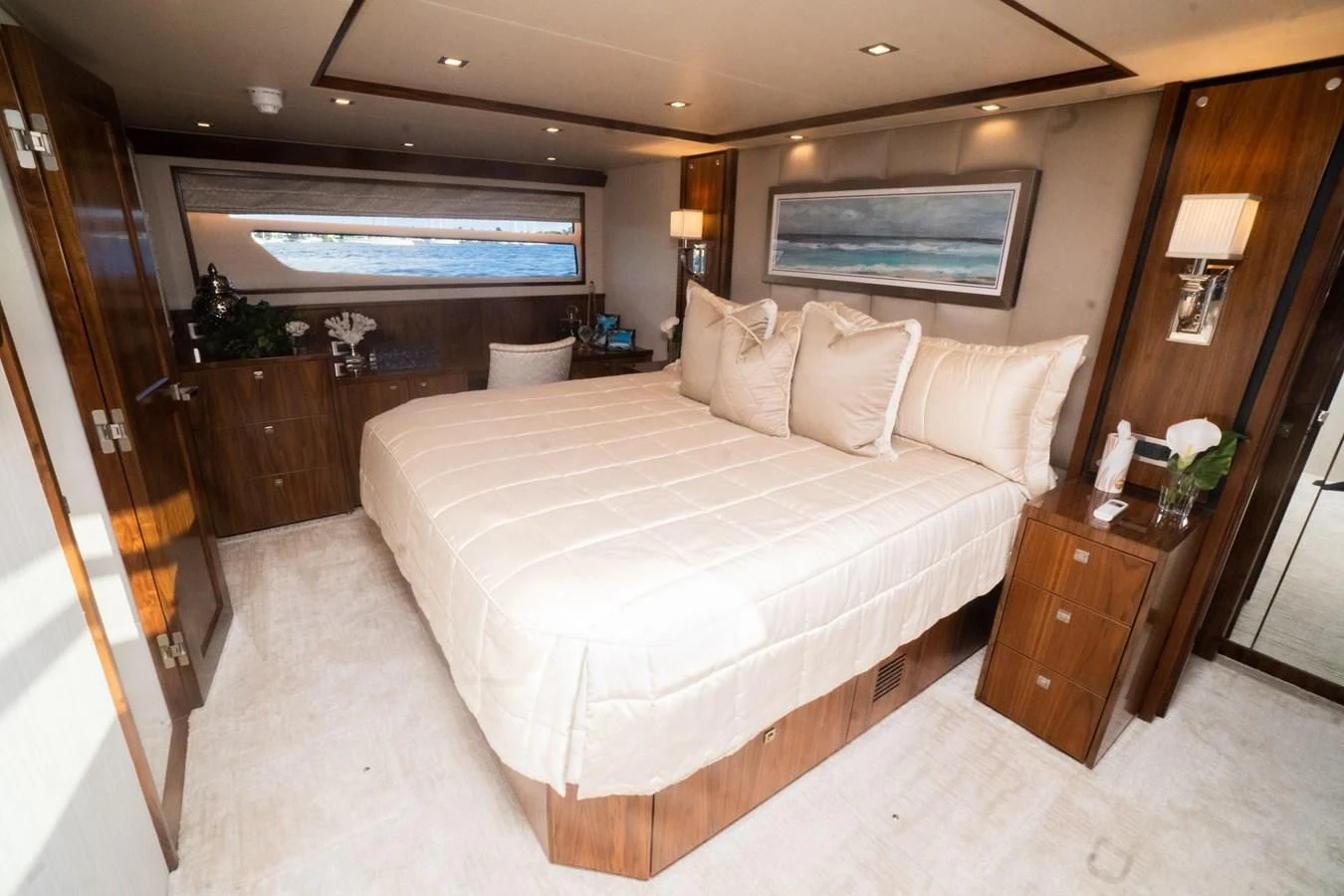 a hotel room with a large bed aboard KALEEN Yacht for Sale