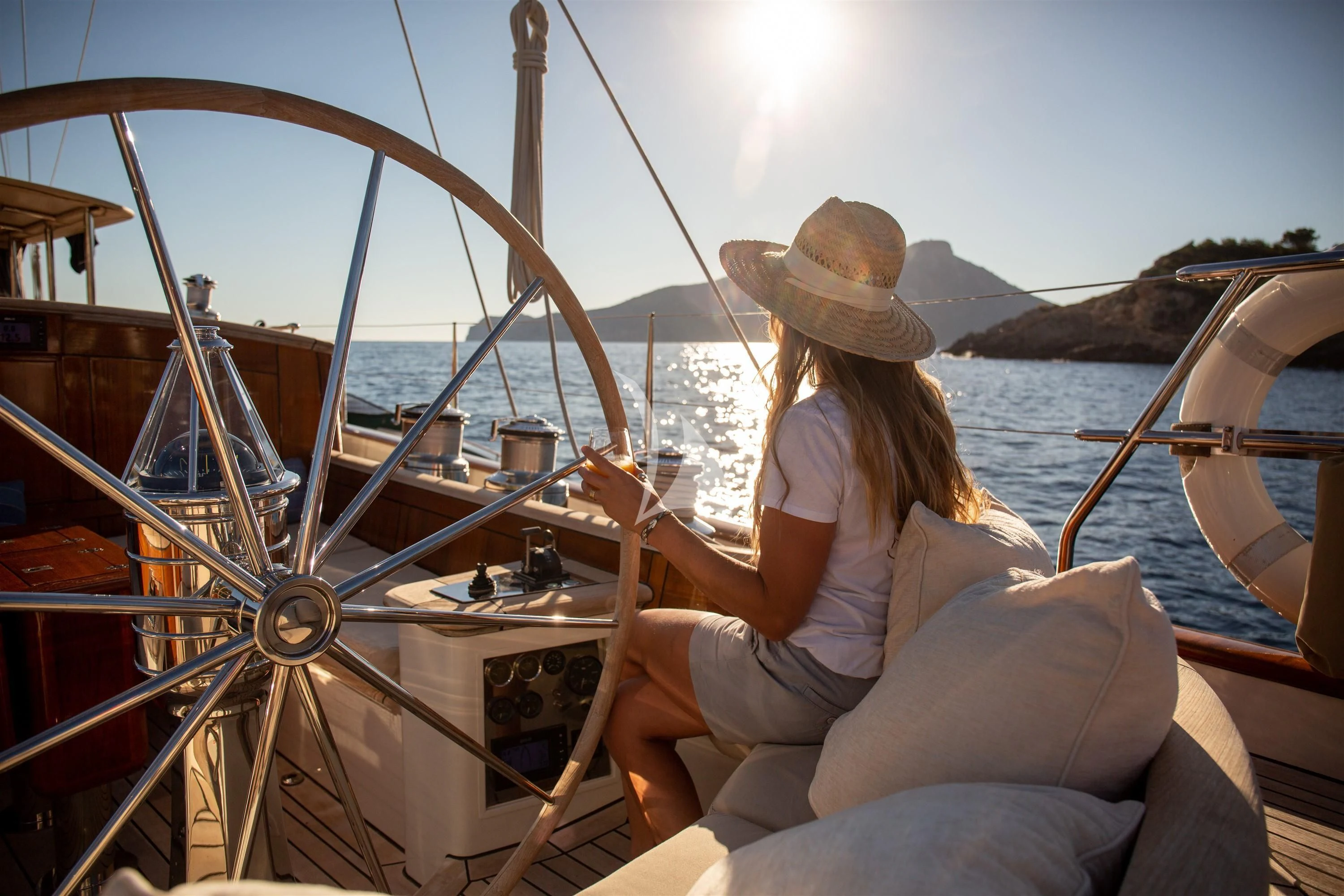 a person sitting on a boat aboard KEALOHA Yacht for Sale