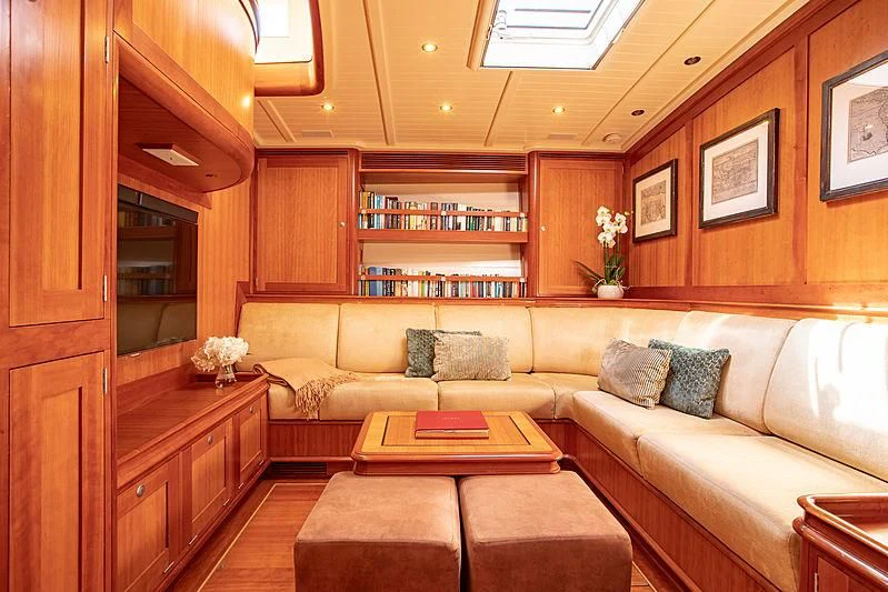 a living room with a couch and a table aboard KEALOHA Yacht for Sale