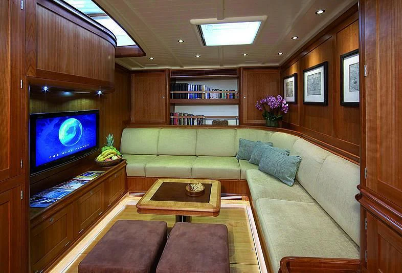 a living room with a couch and a tv aboard KEALOHA Yacht for Sale
