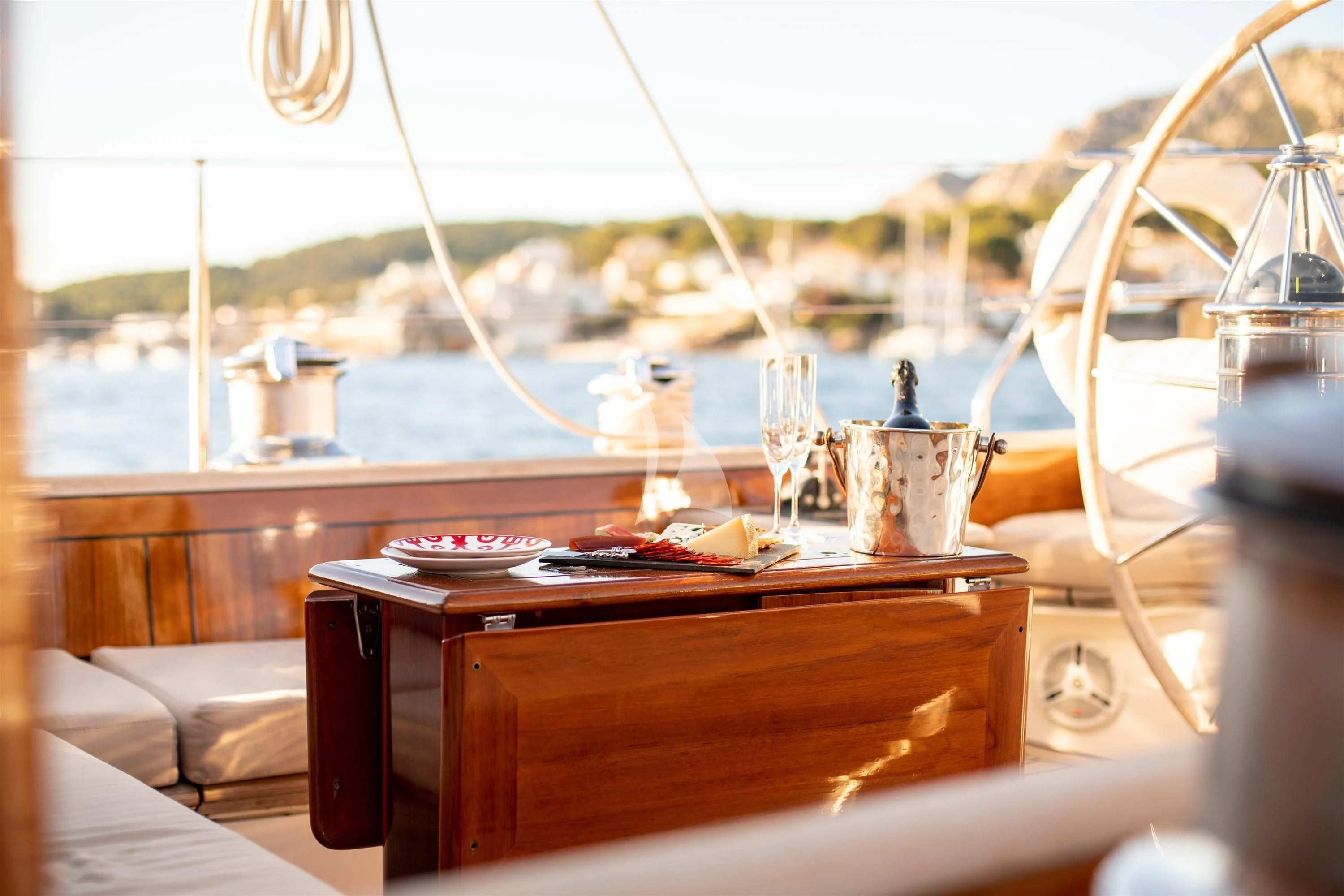 a table with a plate and glasses on it aboard KEALOHA Yacht for Sale