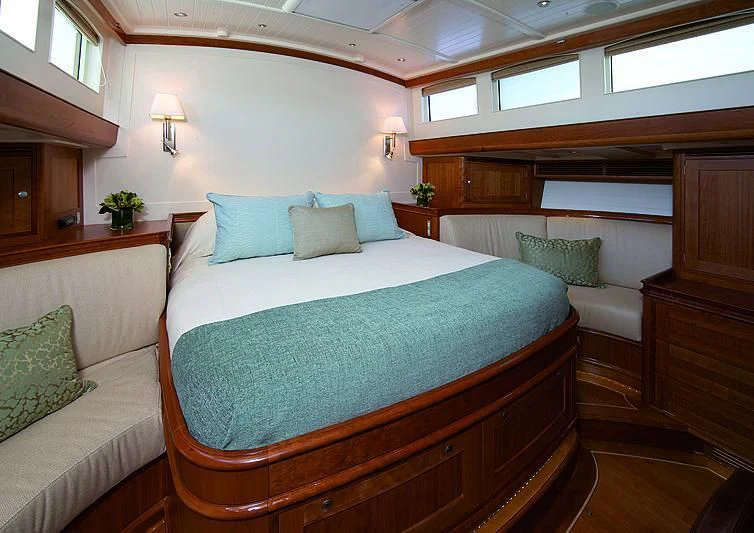 a bed with pillows and pillows aboard KEALOHA Yacht for Sale