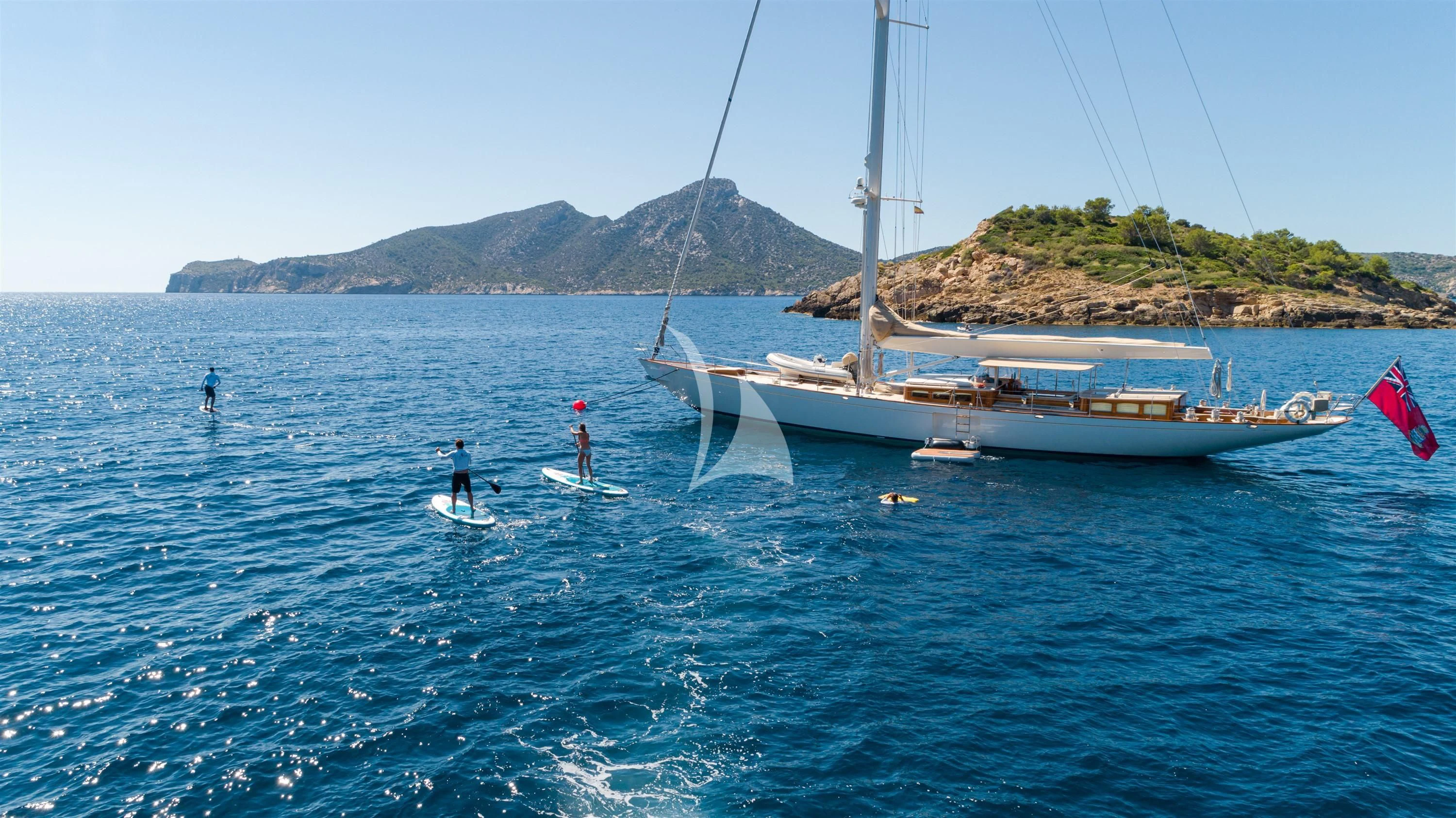 a couple of people on surfboards in the water aboard KEALOHA Yacht for Sale