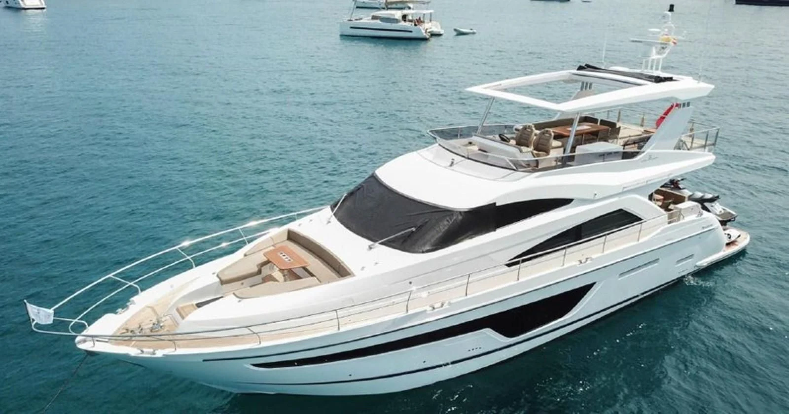 a white boat in the water aboard FAIRLINE SQUADRON 65 Yacht for Sale