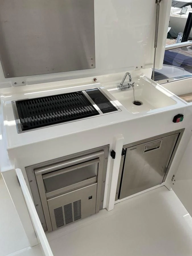 a kitchen with a sink and a window aboard FAIRLINE SQUADRON 65 Yacht for Sale