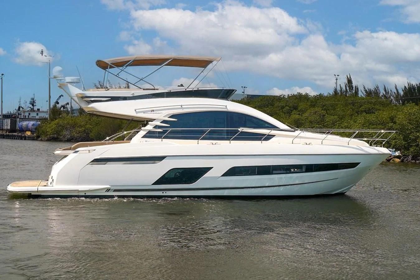 a white yacht in a body of water aboard FAIRLINE SQUADRON 65 Yacht for Sale