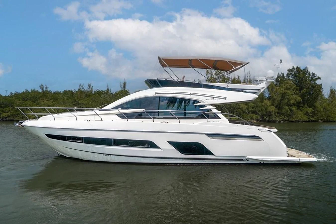 a white yacht on the water aboard FAIRLINE SQUADRON 65 Yacht for Sale
