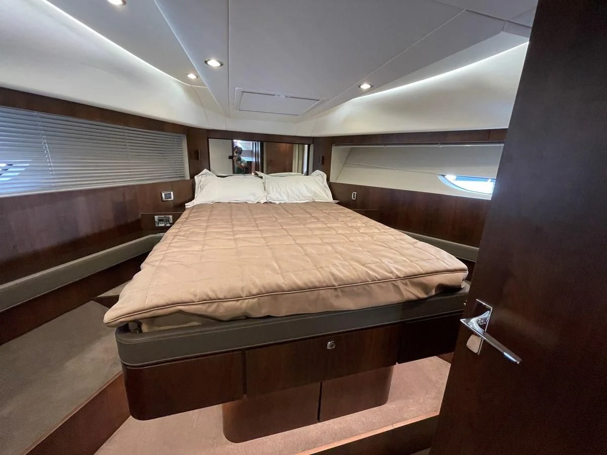 a bed in a room aboard FAIRLINE SQUADRON 65 Yacht for Sale