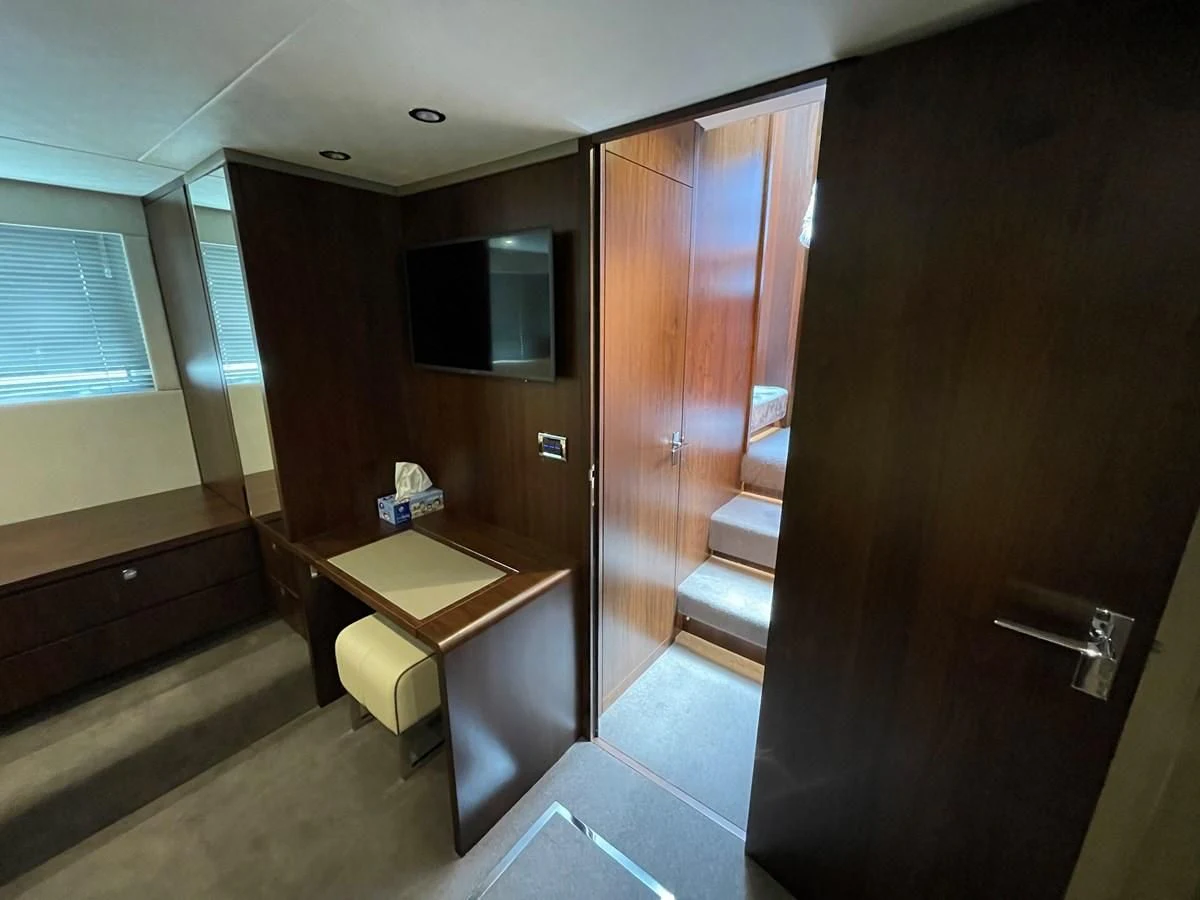 a room with a desk and a window aboard FAIRLINE SQUADRON 65 Yacht for Sale