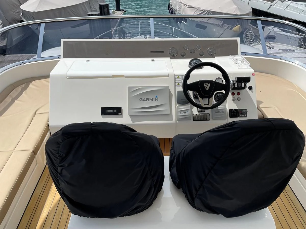 a black hat on a table aboard FAIRLINE SQUADRON 65 Yacht for Sale