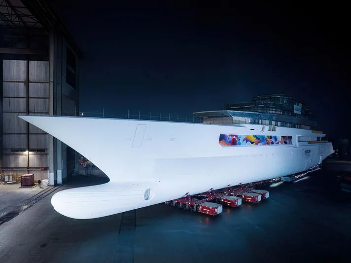 a large cruise ship docked aboard DREAMBOAT Yacht for Sale