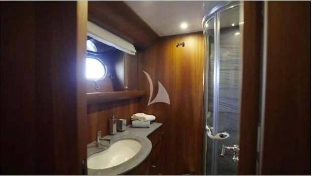 a bathroom with a sink and a shower aboard BIANCA II Yacht for Charter
