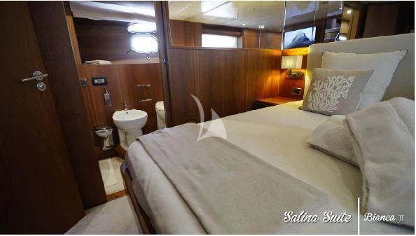 a bed in a room aboard BIANCA II Yacht for Charter