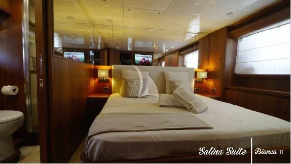 a bed in a room aboard BIANCA II Yacht for Charter