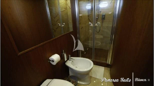a bathroom with a glass shower aboard BIANCA II Yacht for Charter