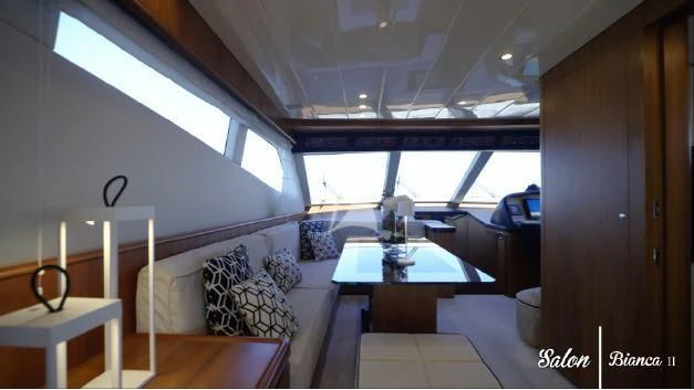 a room with a table and chairs aboard BIANCA II Yacht for Charter