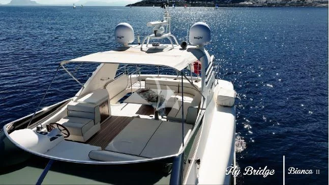 a white boat on the water aboard BIANCA II Yacht for Charter