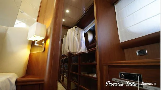 a room with a closet and a bed aboard BIANCA II Yacht for Charter