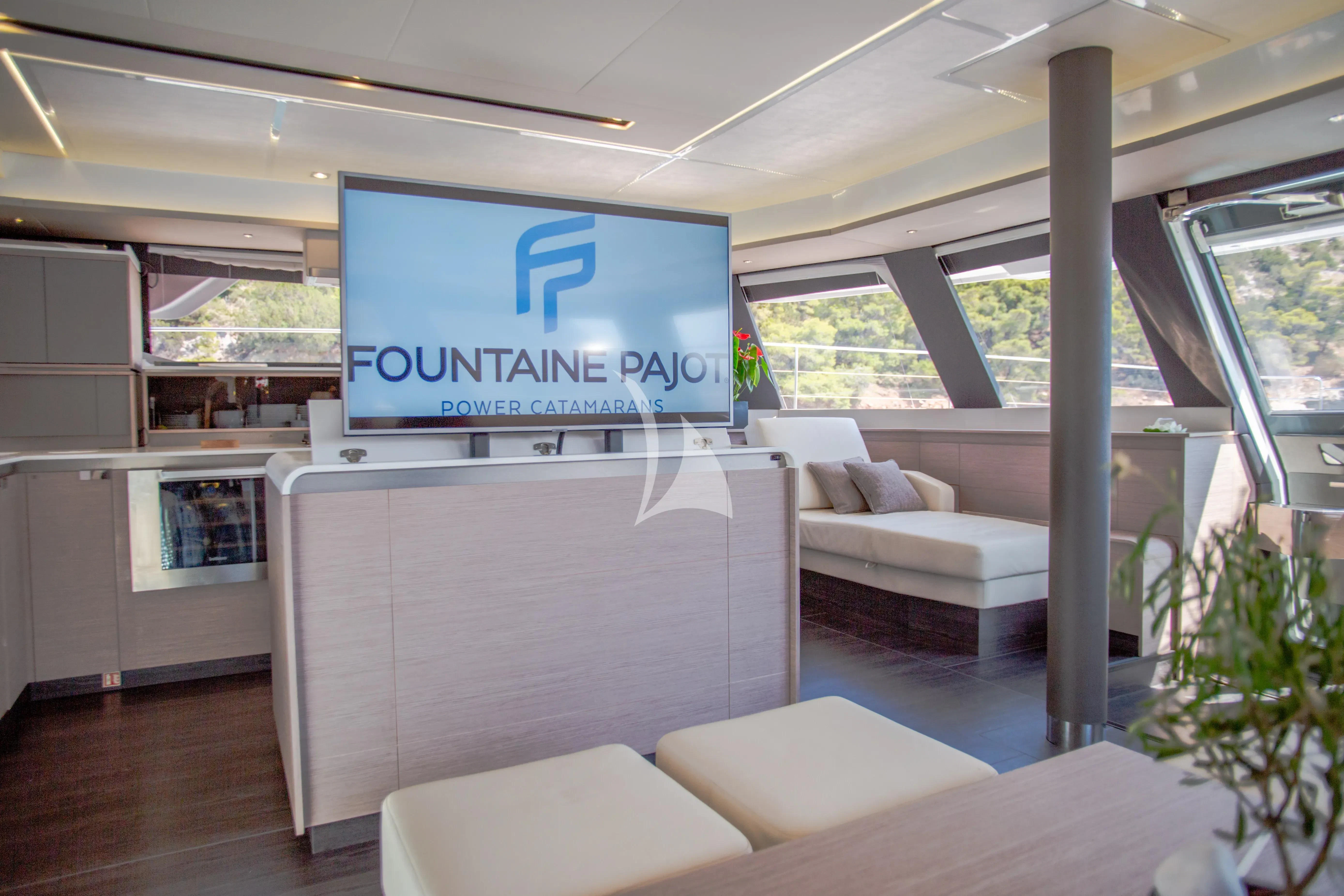 a room with couches and a large screen aboard MAJESTY OF GREECE Yacht for Charter
