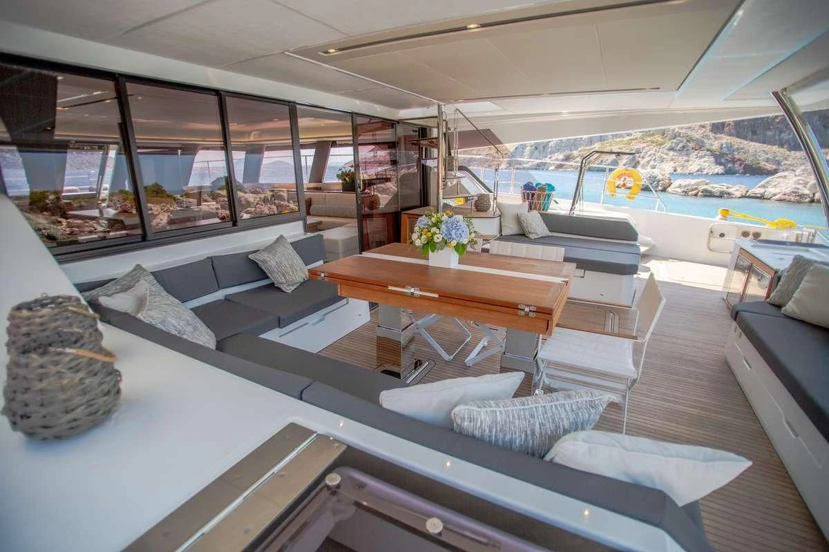a room with a pool table and couches aboard MAJESTY OF GREECE Yacht for Charter