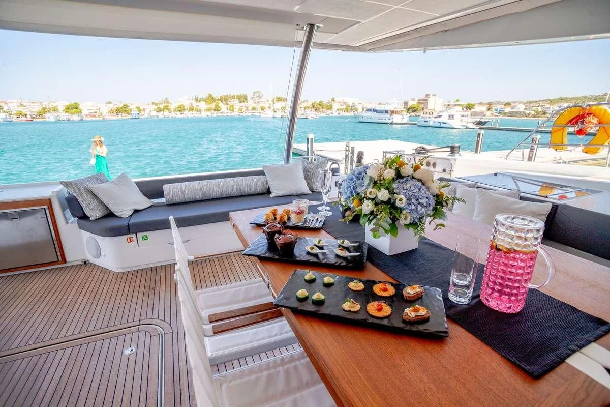 a table with food and drinks on it aboard MAJESTY OF GREECE Yacht for Charter