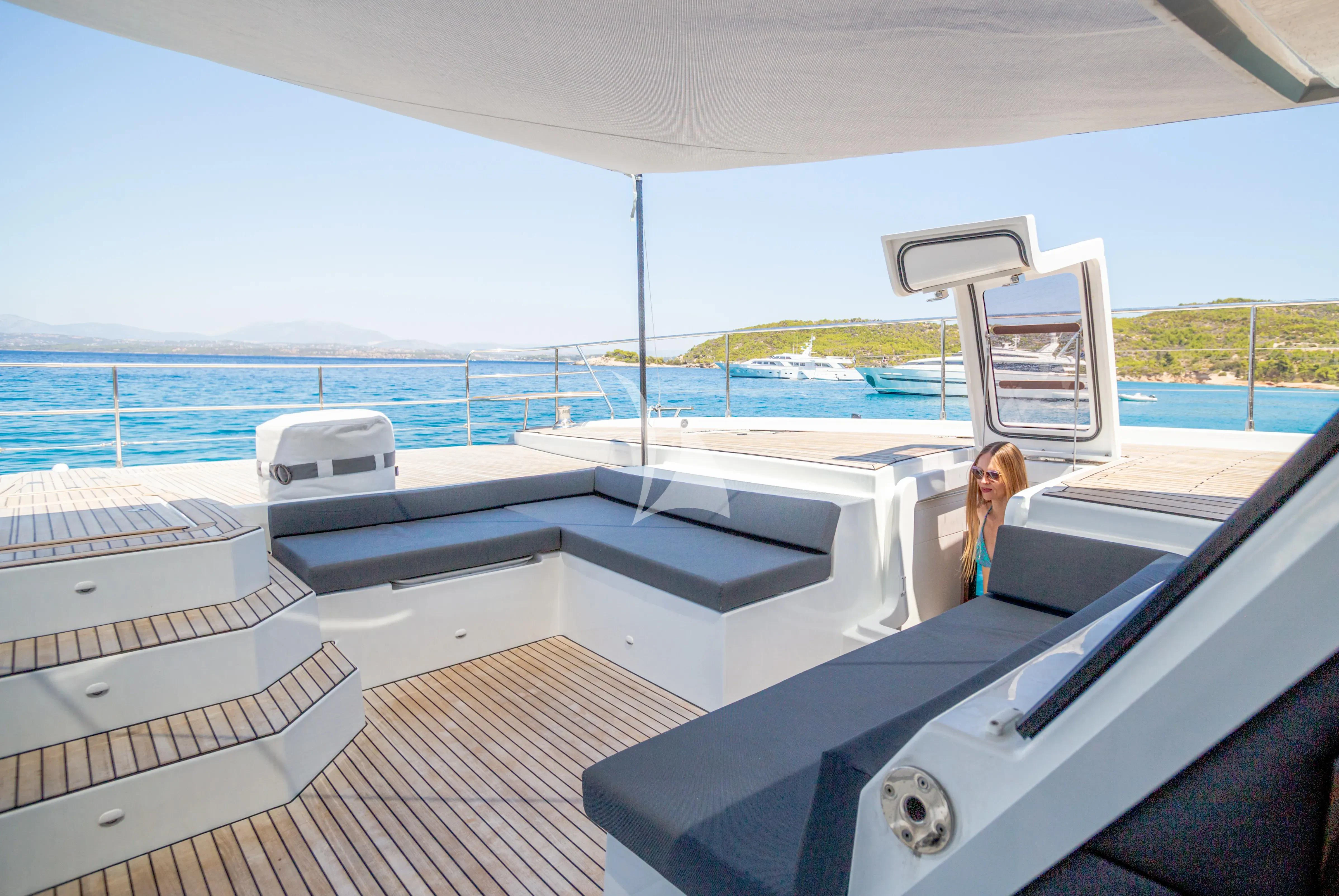 a person on a deck of a boat aboard MAJESTY OF GREECE Yacht for Charter