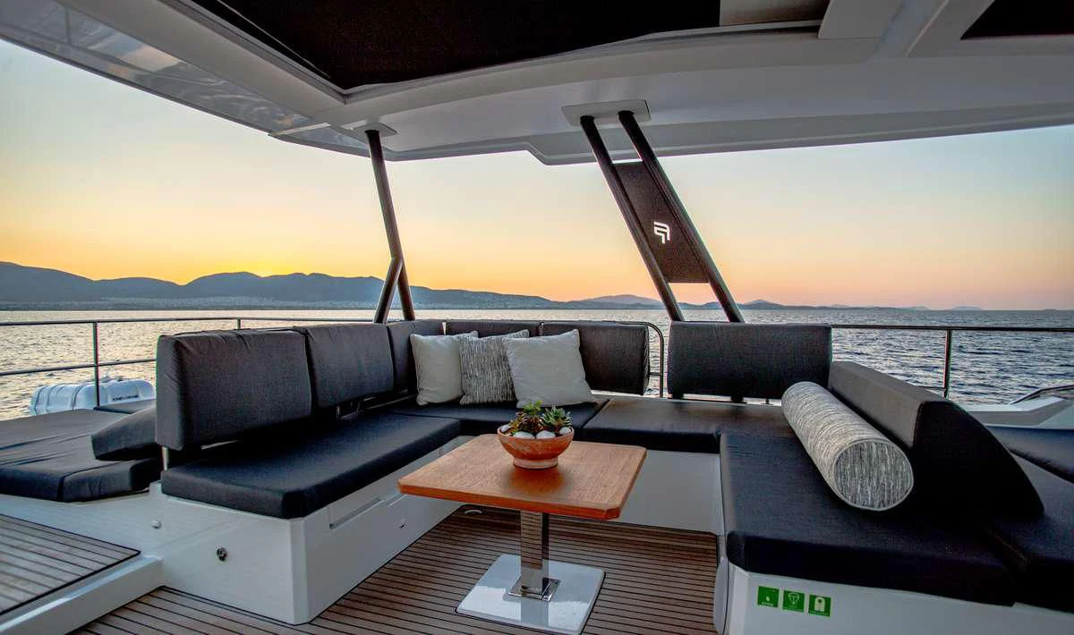 a large sofa and a table on a boat aboard MAJESTY OF GREECE Yacht for Charter
