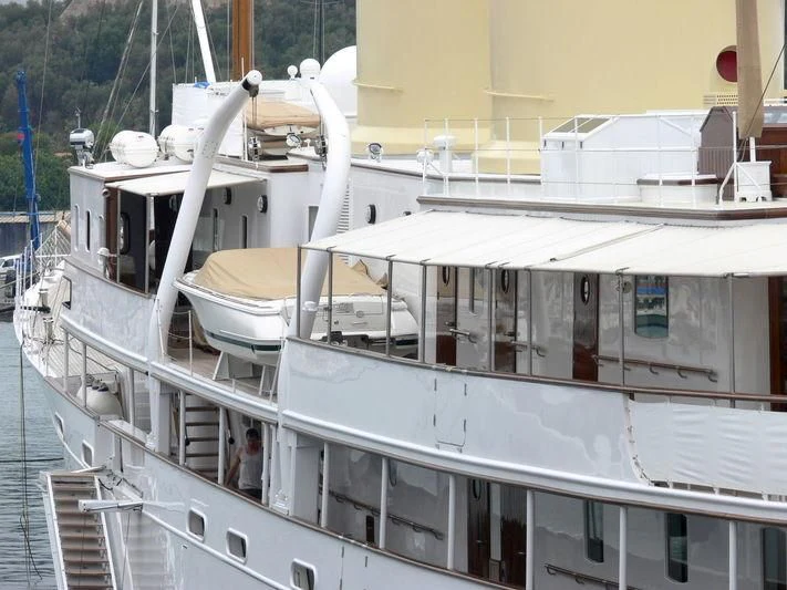 a boat with a large white sail aboard TALITHA Yacht for Sale