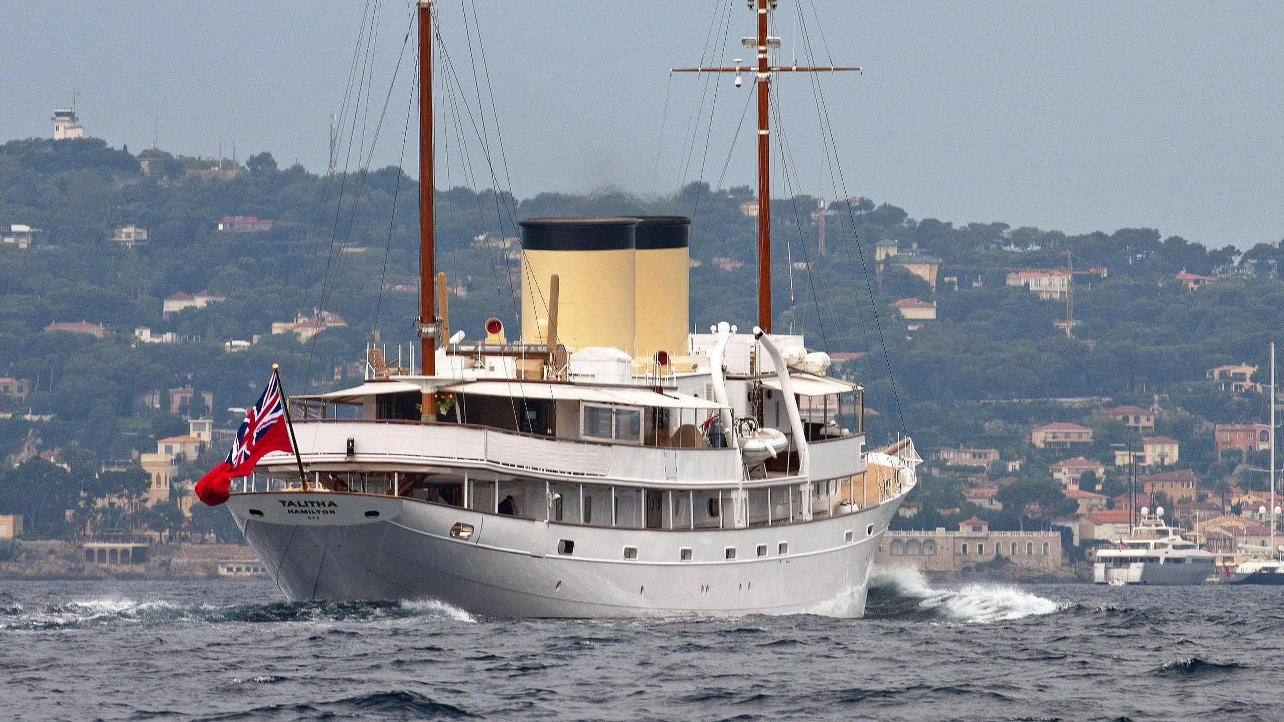 a large ship in the water aboard TALITHA Yacht for Sale