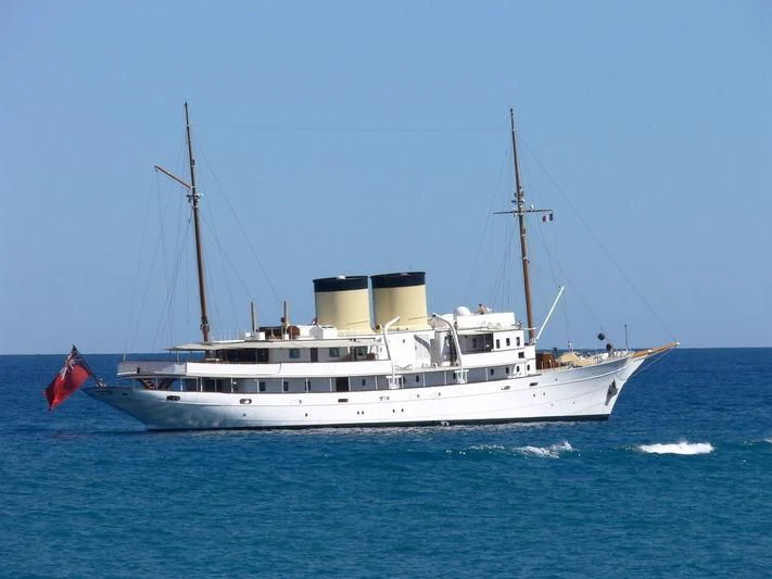 a large white boat in the water aboard TALITHA Yacht for Sale