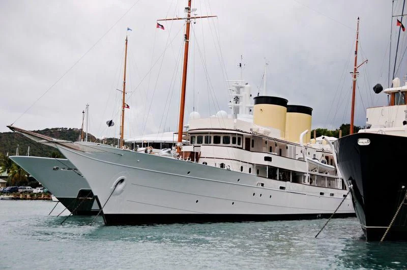 a couple of boats sit in the water aboard TALITHA Yacht for Sale