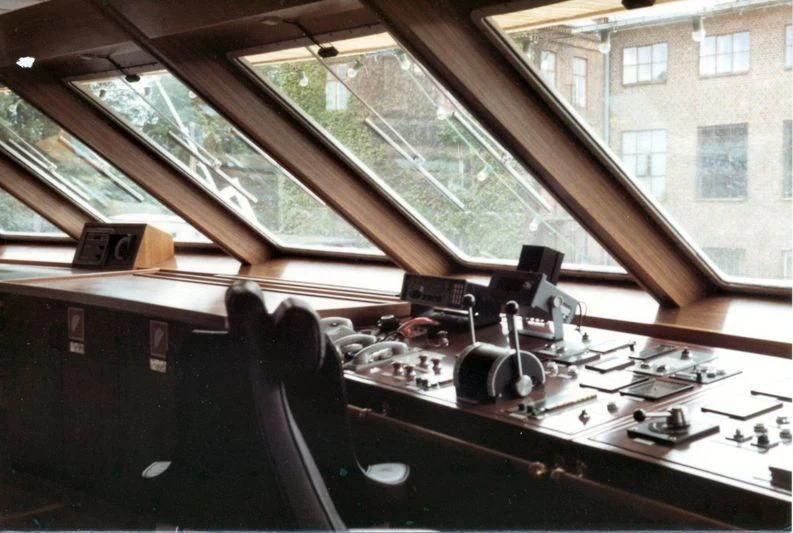 a room with a large window and a desk with a computer on it aboard BASRAH BREEZE Yacht for Sale