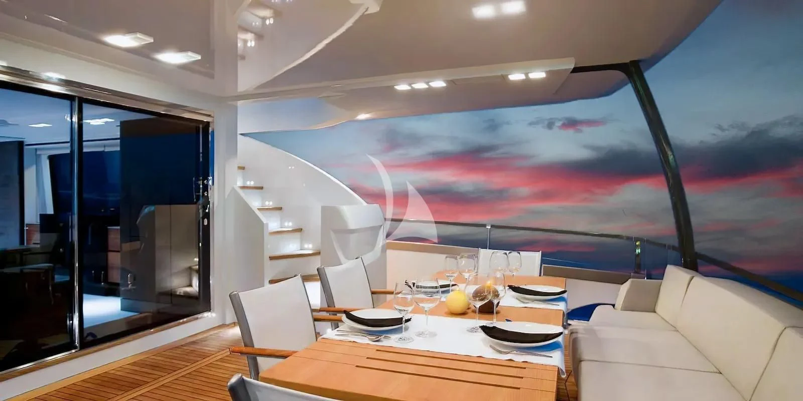 a room with a table and chairs aboard QUASAR Yacht for Sale