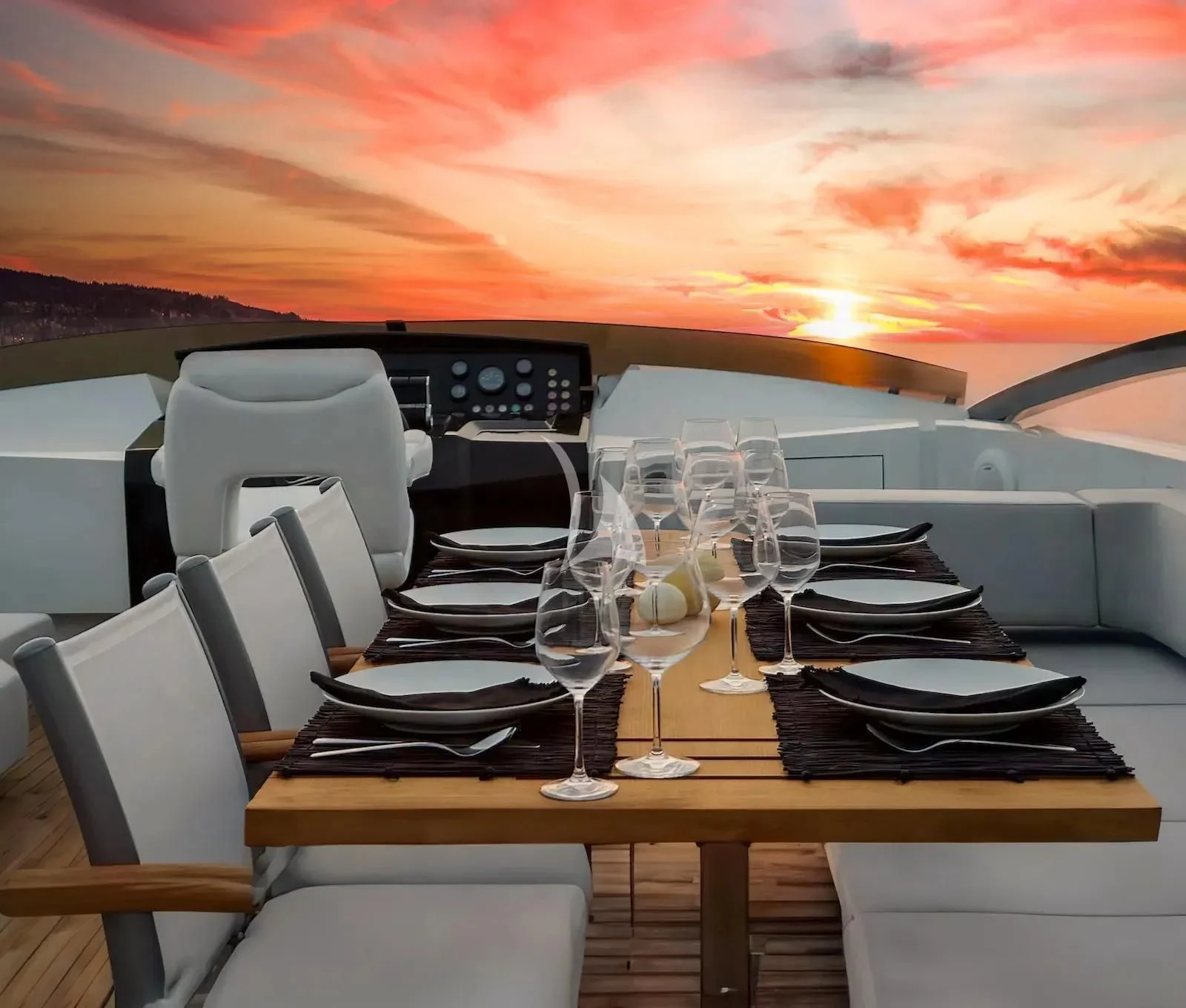 a table with plates and glasses on it aboard QUASAR Yacht for Sale
