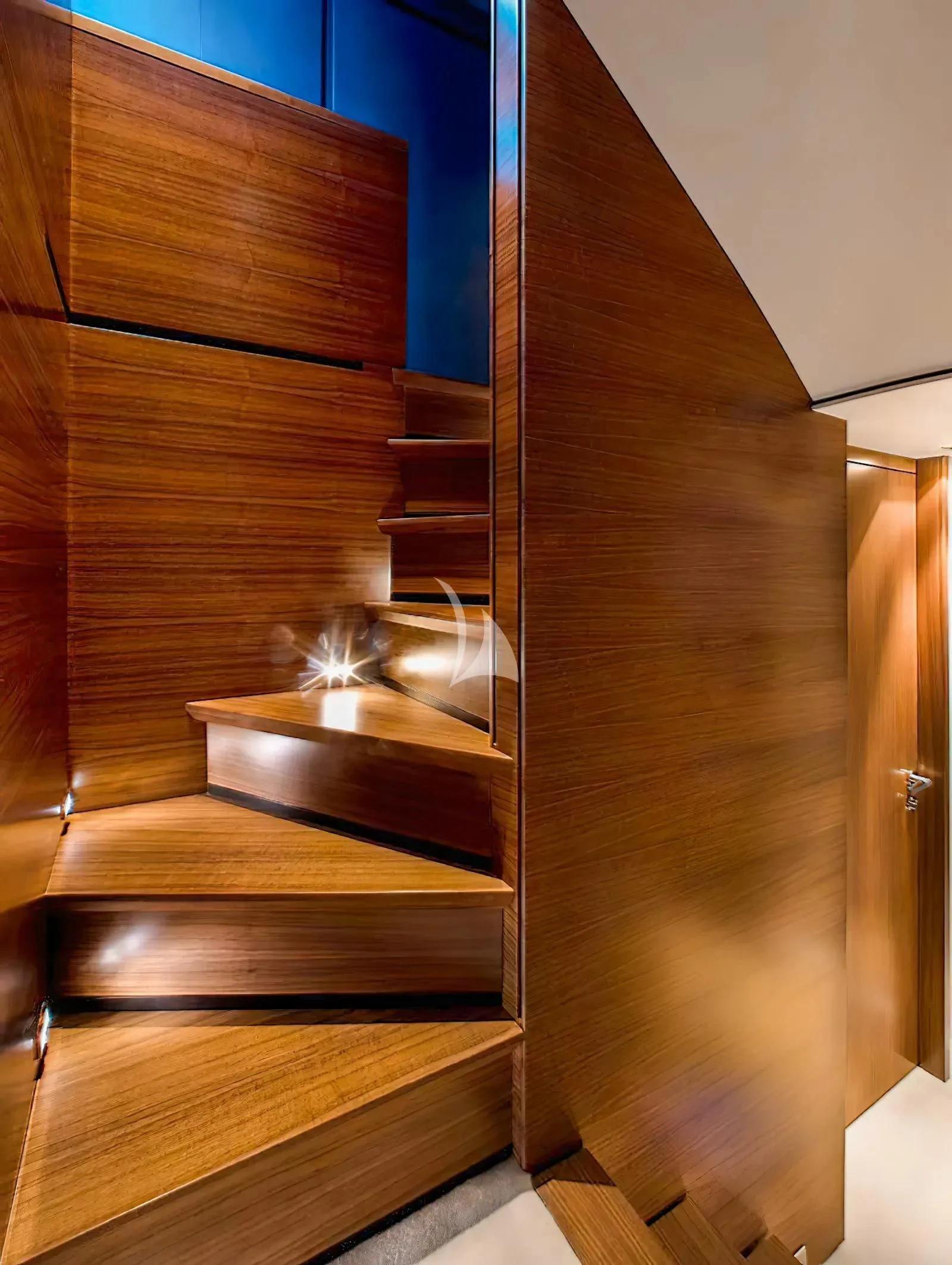 a wooden staircase with a glass window aboard QUASAR Yacht for Sale